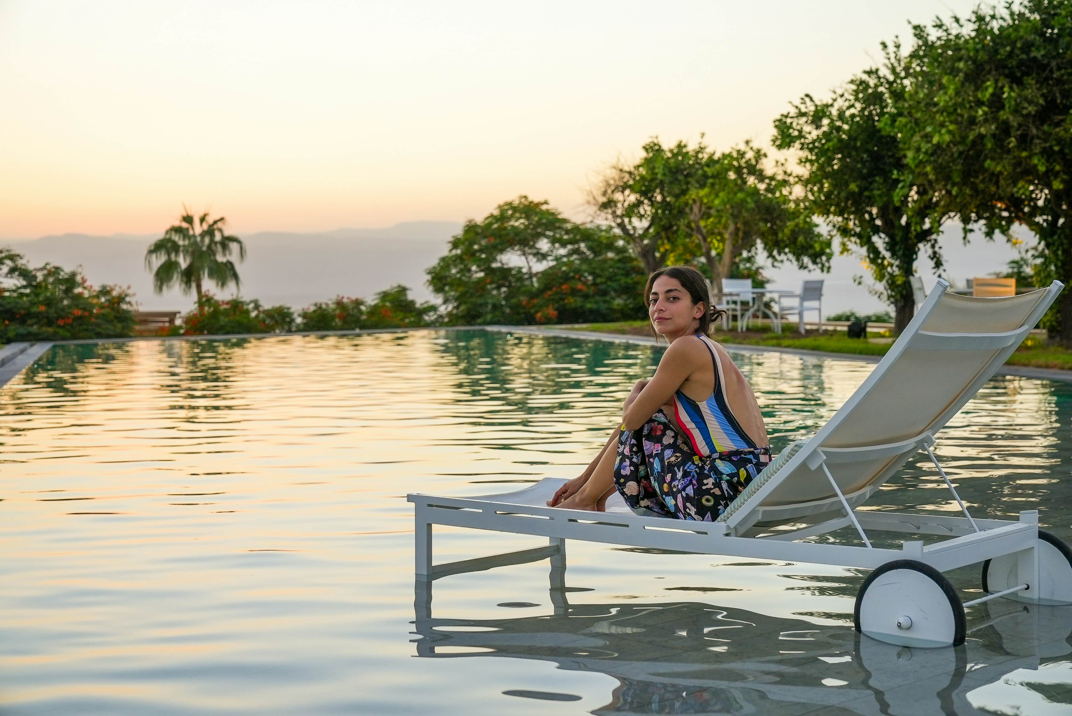 Tania George relaxes by the pool in Kempinski, Jordan © Jack Pearce/Lonely Planet